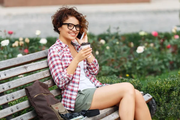 Nice girl sitting on the bench