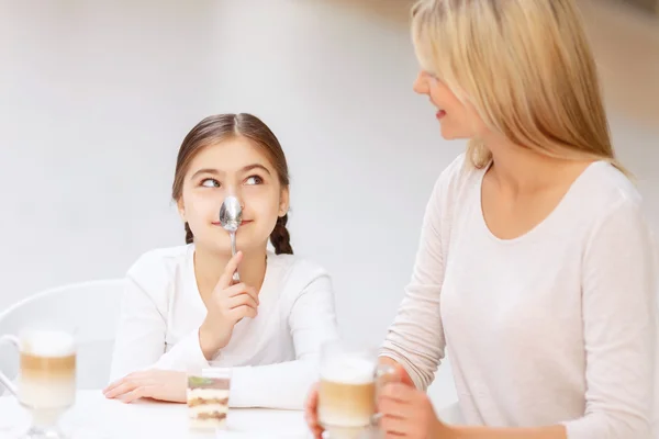 Friendly family sitting in the cafe