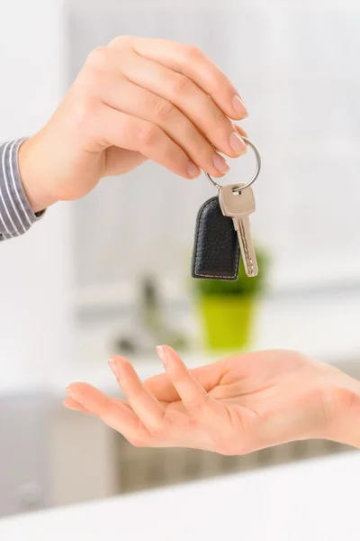 Hotel client receiving her room key.