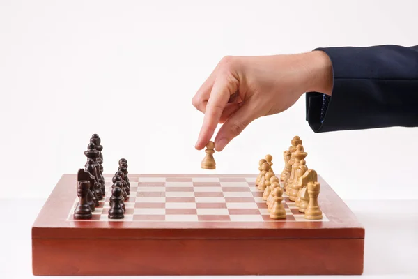 Person making first chess move.