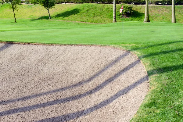 Manicured green grass of Fairway on golf course