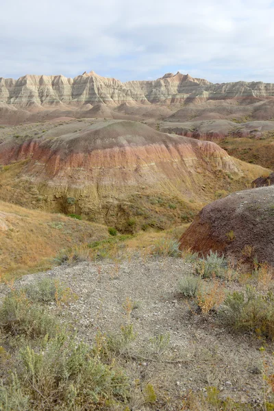 Badlands landscape, formed by deposition and erosion by wind and water, contains some of the richest fossil beds in the world, Badlands National Park, South Dakota, USA