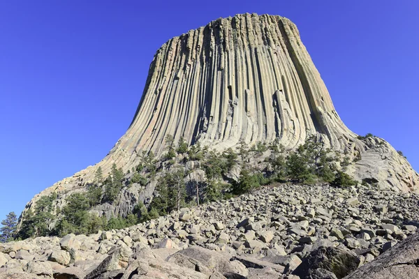 Devils Tower National Monument, a geological landform rising from the grasslands of Wyoming, is a popular tourist attraction, source for Native American legend and rock climbing goal for climbers