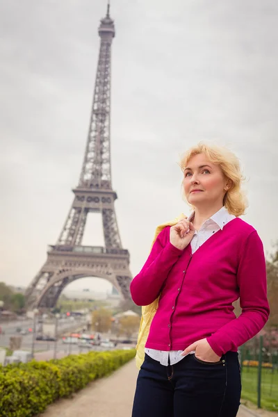 Mature blond woman posing in Paris