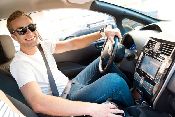 Man sitting at the wheel of car