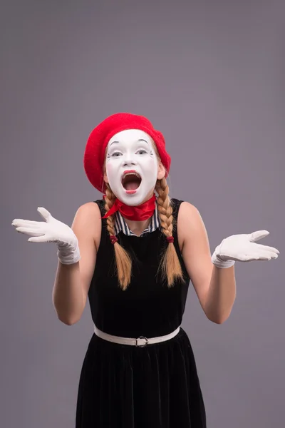 Mime shouting and looking at the camera