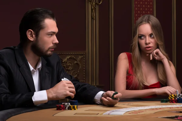 Handsome  man and beautiful woman in casino