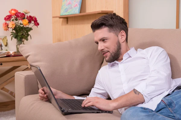 Handsome man with notebook computer