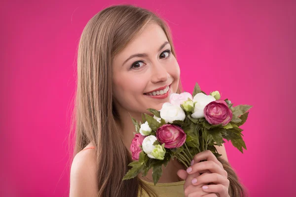 Girl holding  bunches  of roses