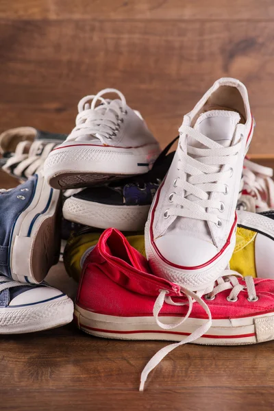 Multicolored youth gym shoes on floor