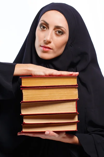 Beautiful Muslim woman holding a book