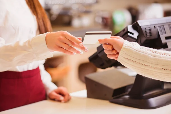 Customer paying to shop assistant