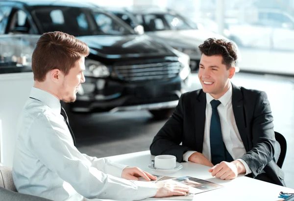 Handsome young man in dealership