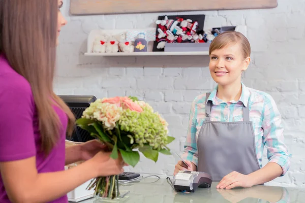 Paying with credit card at florist shop