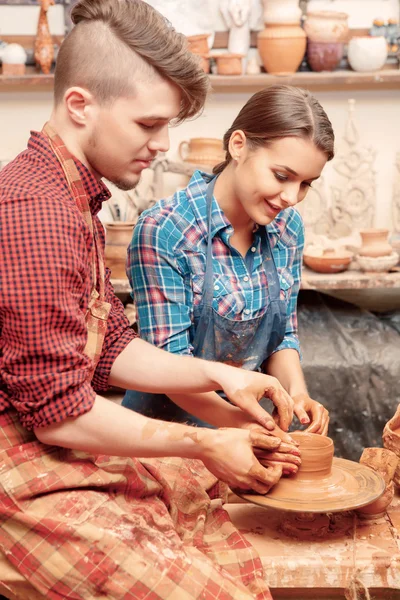 Couple works with clay