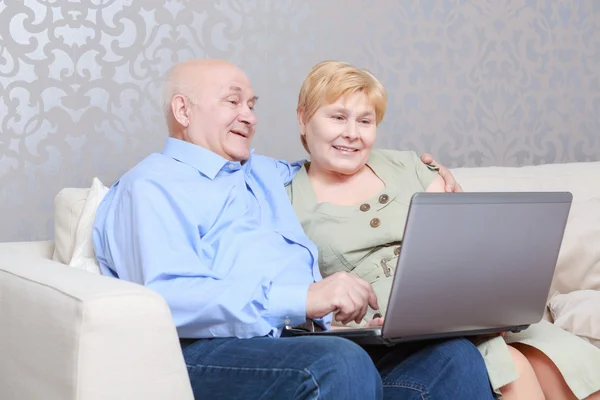 Couple with a laptop at home