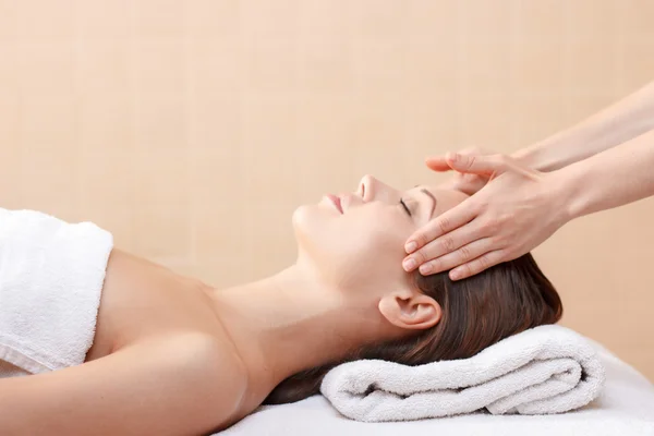 Professional spa specialist making massage