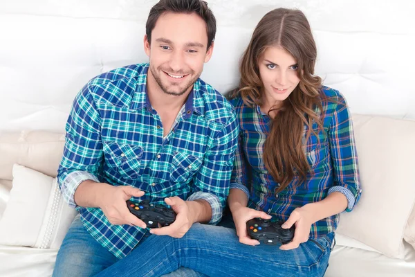 Pleasant couple playing video games