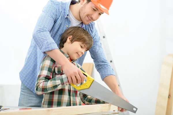 Positive father and son doing renovation