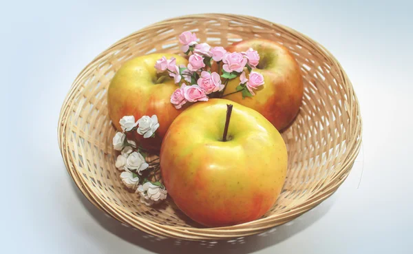 Three apples  with flowers