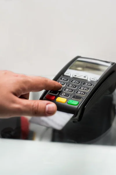 Credit or debit card password payment. Customer hand is entering
