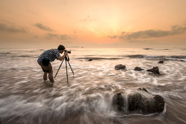 Photographer shooting seascape