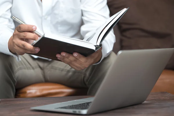 Man ridding book on couch