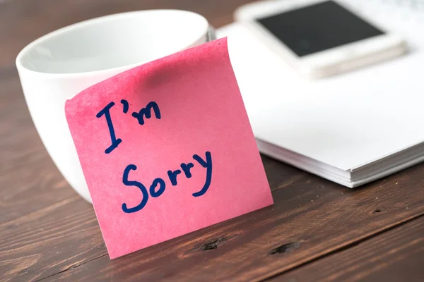 I\'m sorry note on paper sticker