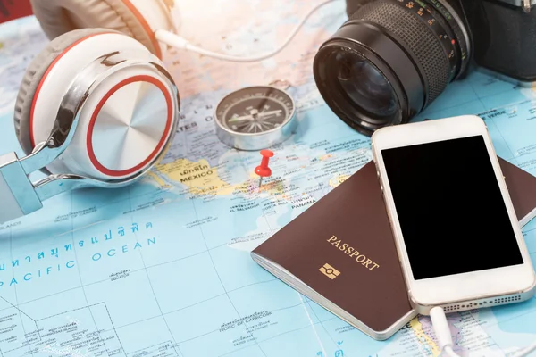 Preparation for travel, cell phone, money, passport, road map