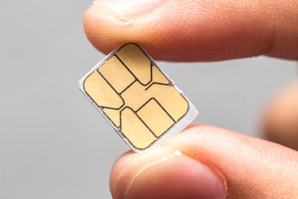 Hand hold micro nano SIM card isolated