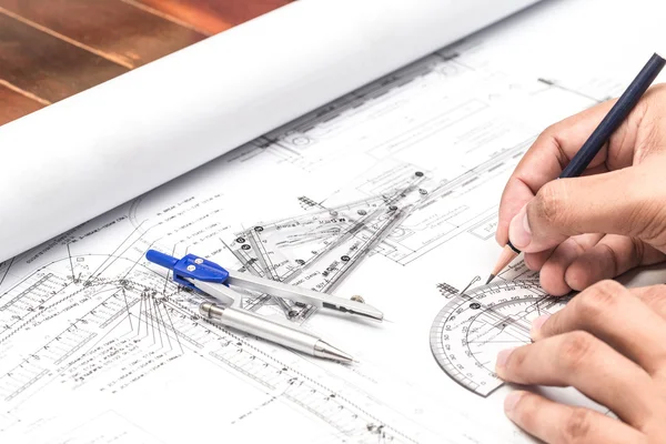 Close-up Of Architect Hands Working On A Blueprint In Office. Bl