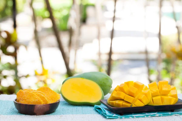 Fresh and dried mango fruit with smoothie juice