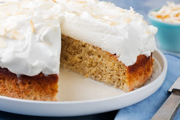 Three milk cake, tres leches cake with coconut. Traditional dessert of Latin America.
