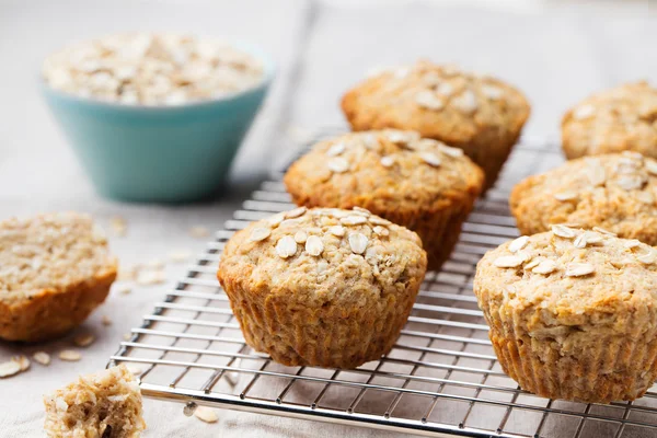 Healthy vegan oat muffins, apple and banana cakes on a cooling rack