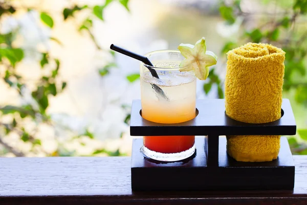 Tropical juice and cold towel, welcome drink in the hotel and spa Outdoor background