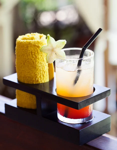 Tropical juice and cold towel, welcome drink in the hotel and spa Outdoor background