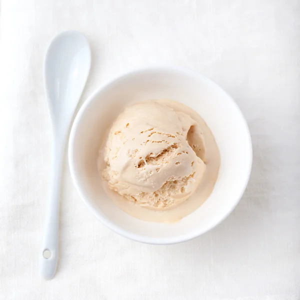 Ice cream with Earl grey tea flavor in white ceramic bowl
