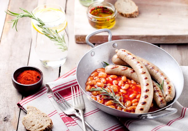 Grilled sausages with beans