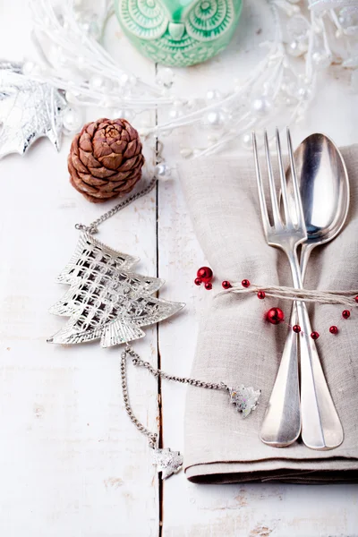 Christmas and New year table place setting with decorations.