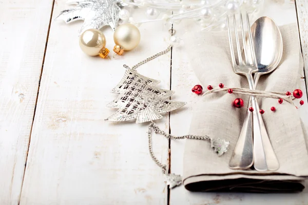 Christmas and New year table place setting with decorations.