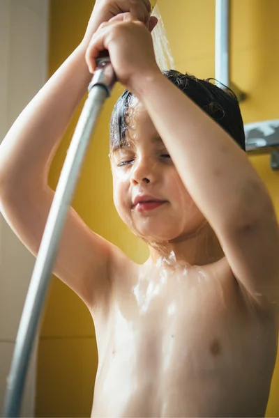 Little boy having shower