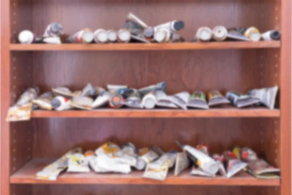 Painting tubes on shelves