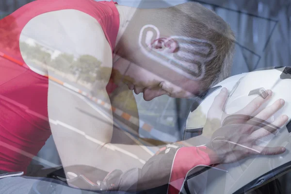 Double exposure go-kart driver and helmet