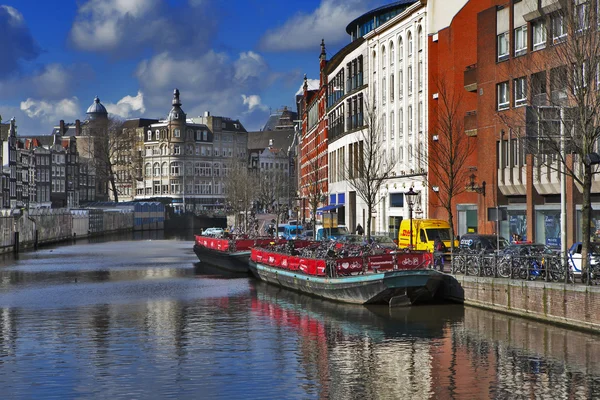 Street view in Amsterdam. Amsterdam is the capital of Netherlands and a popular touristic destination.