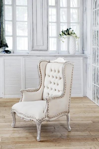 Luxury armchair in white inerior