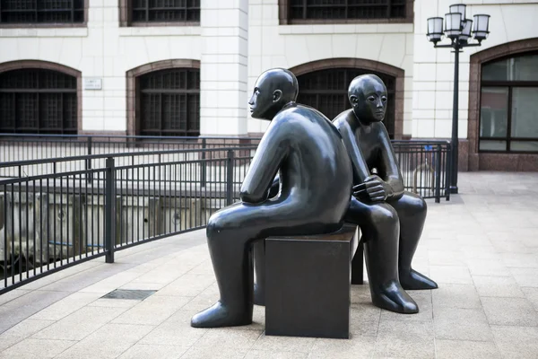 Bronze sculpture is situated in Cabot Square