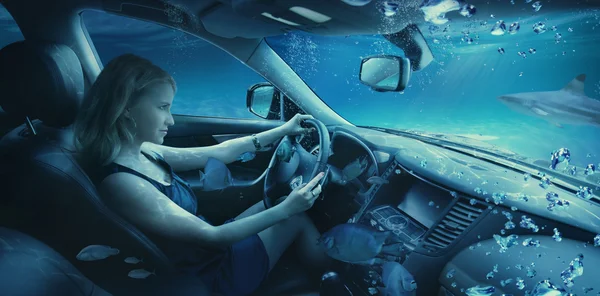 Woman driving car underwater
