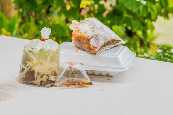 Foam containers and plastic bags for take away food