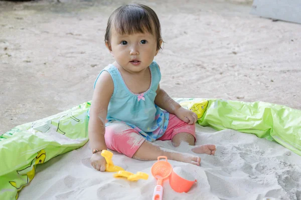 Baby playing toys in sand at home, is fantastic in aiding a toddler s development and it  such fun activity to boot