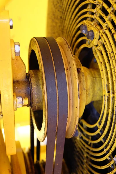 Yellow engine transmission from wedge belts and pulleys